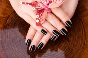 beautiful-women-hands-with-black-manicure-after-spa-procedures-spa-treatment-concept